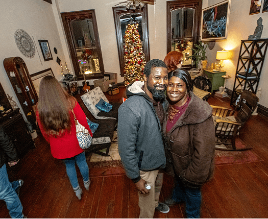 african american couple smiling at camera downtown fayetteville
